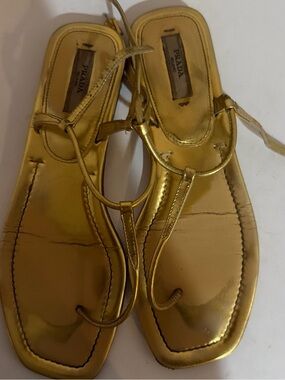 PRADA gold slide on sandals